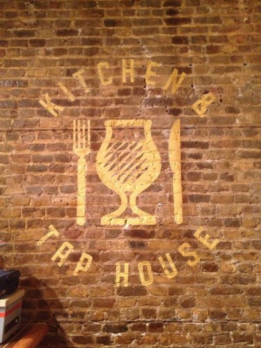 Hand painted logo on historic brick