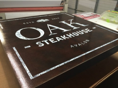 Oak Steakhouse painted sign